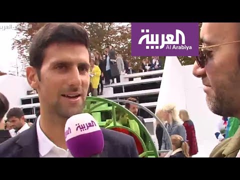 بالفيديو لاعب التنس العالمي novak djokovi في عرض أزياءlacoste