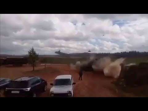russian military helicopter accidentally fires on spectators