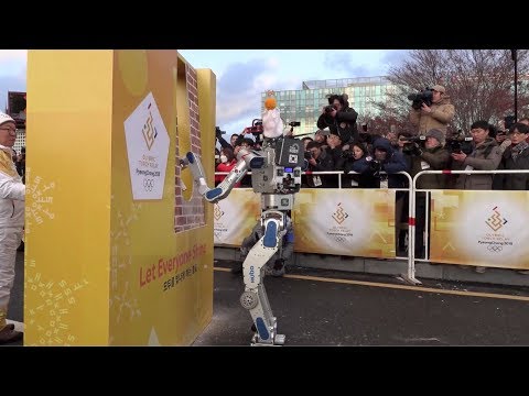 robots run as pyeongchang winter olympics torchbearers
