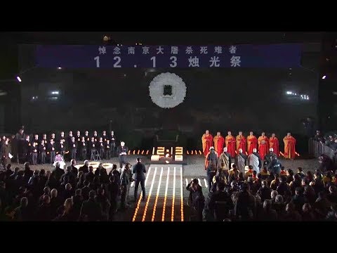 thousands of people light candles for victims