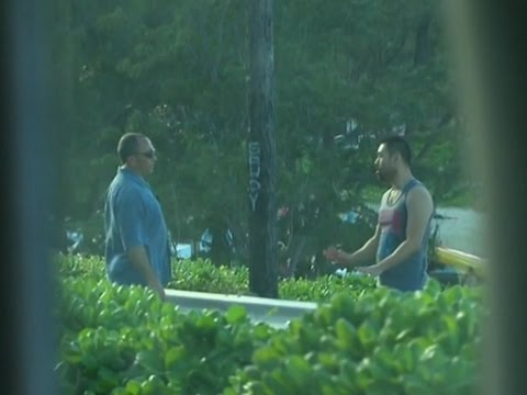 man with drone stopped near obama motorcade