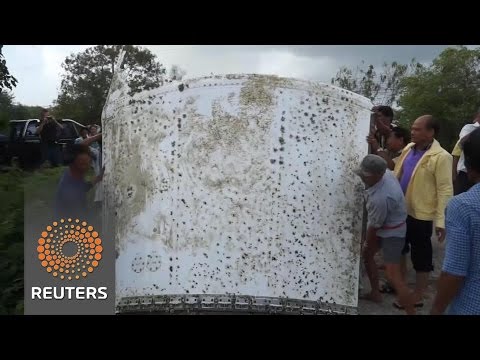 inspect possible plane debris