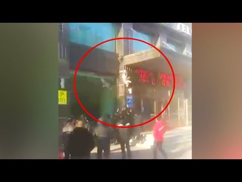 a woman fell off from the building twice