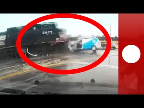 near miss for stranded motorist as train smashes into car