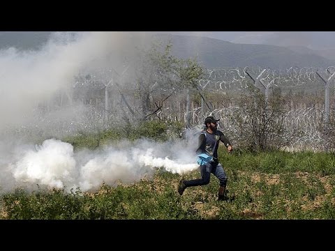 migrants break through fence on fyrom border