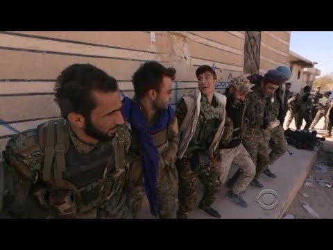 syrian fighters celebrate in raqqa