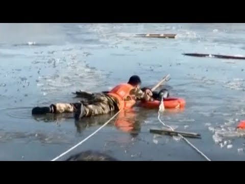 firefighters rescue man stranded in icy lake