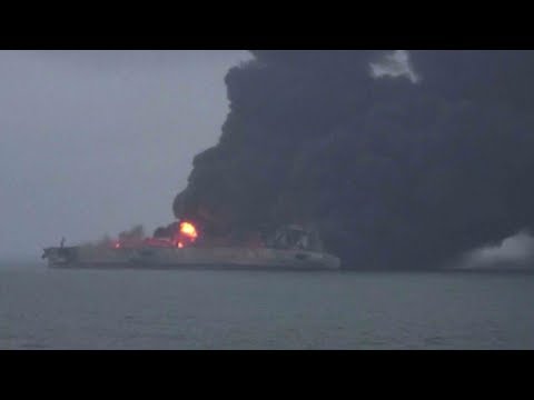 rescuers struggle to bring tanker fire under control