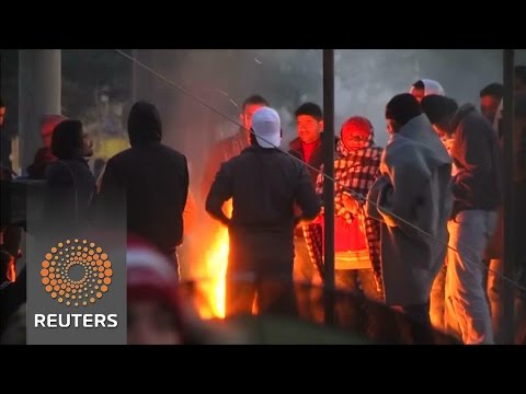 hundreds spend a freezing night on the macedoniagreece border