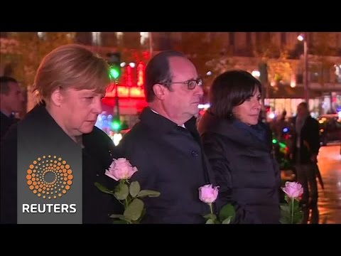 french president francois hollande by german chancellor angela merkel