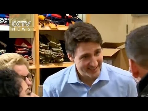 the first planeload of syrian refugees landed in canada